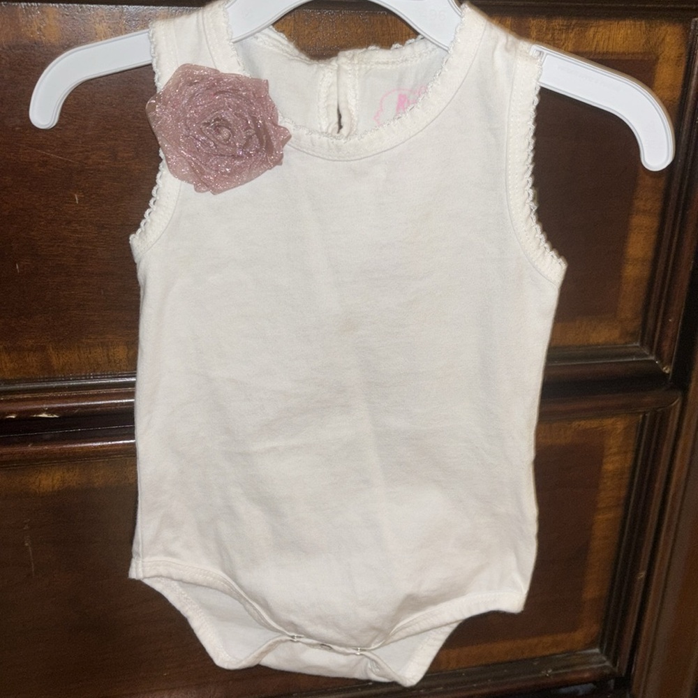 White Baby Onesie with Purple Flower Accent